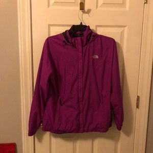 A women’s purple rain jacket the north face